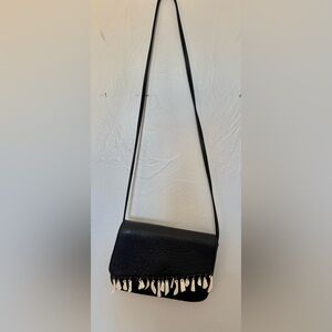 Bison Legacy: Buffalo leather antler tassel purse. Handmade Cody WY